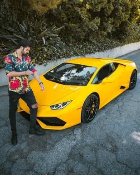 Hooman in front of his yellow Lamborghini